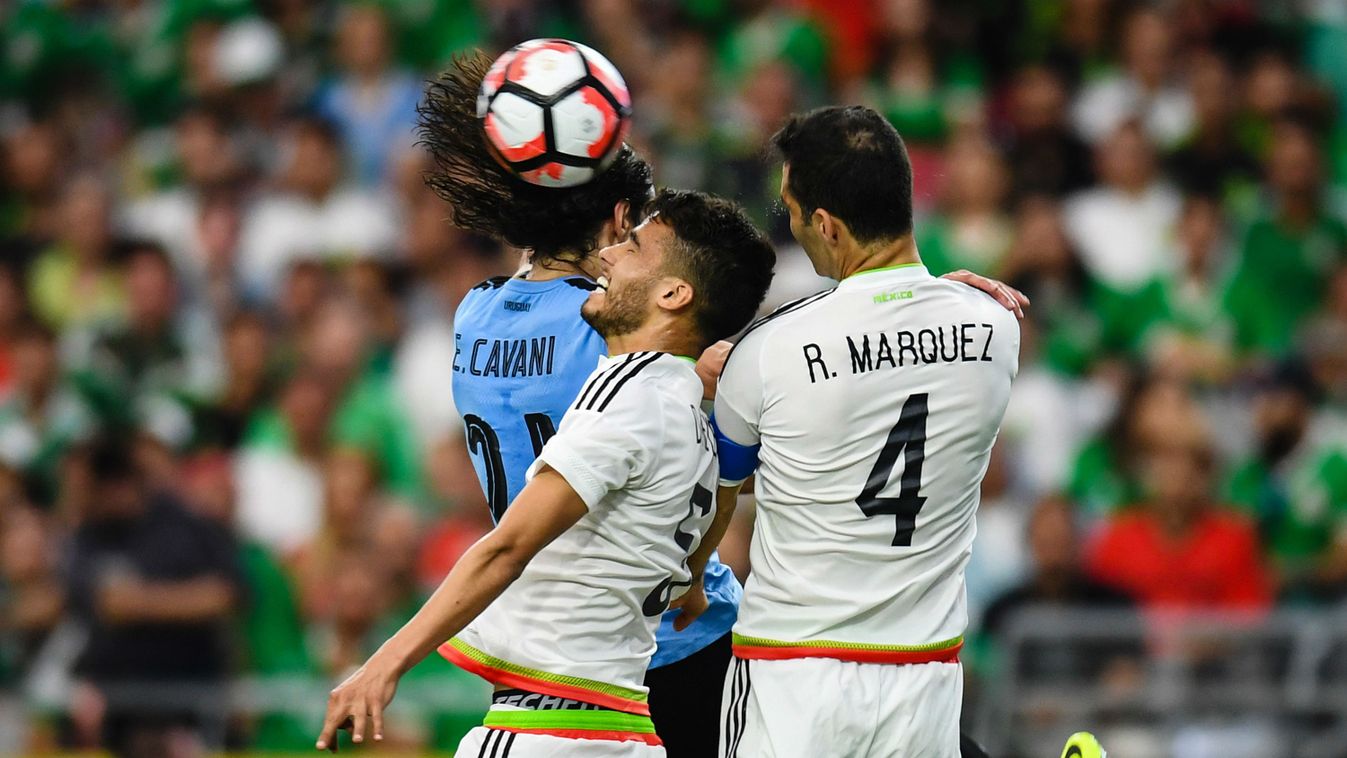 Diego Reyes (C), Rafael Marquez (R) of Mexico struggle for the ball against Edinson Cavani (L) of Uruguay during the 2016 Copa America Centenario Group C match between Mexico and Uruguay 