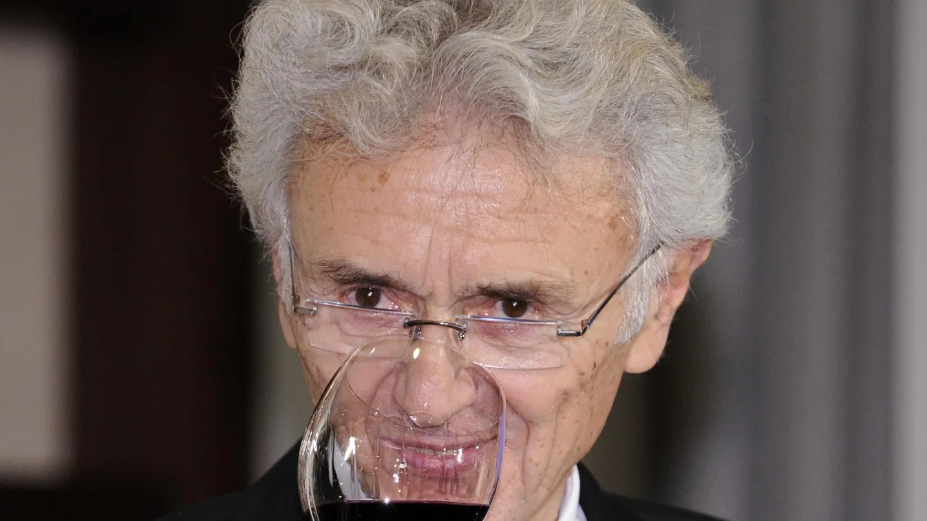 Horizontal French winery owner Georges Duboeuf tastes the 2009 vintage Beaujolais Nouveau wine in Tokyo on November 19, 2009, after the embargo on the wine was removed at midnight. A total of five million bottles of Beaujolais Nouveau wine are expected to