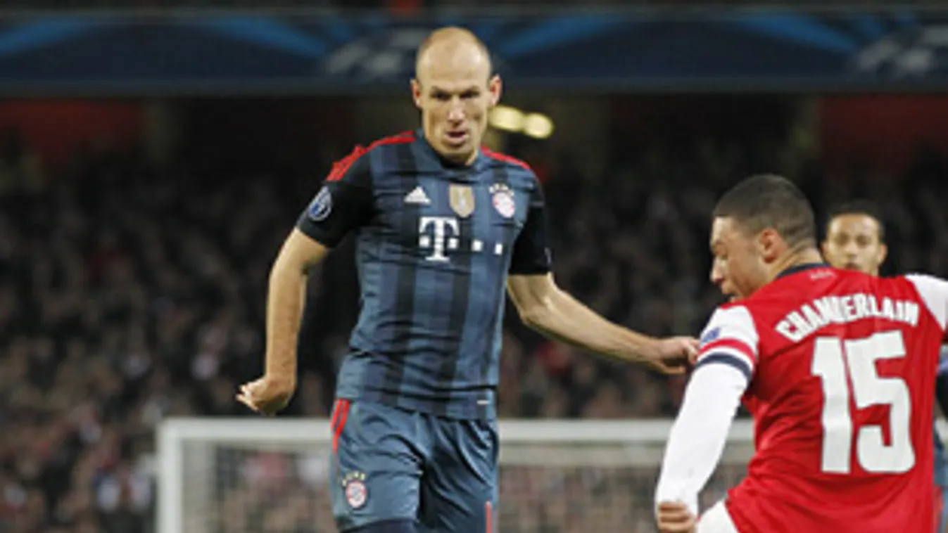 463411727 Bayern Munich's Dutch midfielder Arjen Robben (C) looks for a way through the Arsenal defence during the UEFA Champions League Last 16, first leg football match between Arsenal and Bayern Munich at The Emirates Stadium in north London on Februar