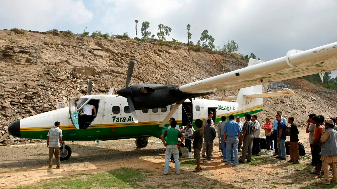 Horizontal (FILES) This file photograph taken on June 1, 2010 shows a Tara Air DHC-6 Twin Otter aircraft, similar to one that went missing early on February 24, 2016 with 21 people on board, at the Lamidanda airstrip some 120 kms east of Kathmandu. A Tara