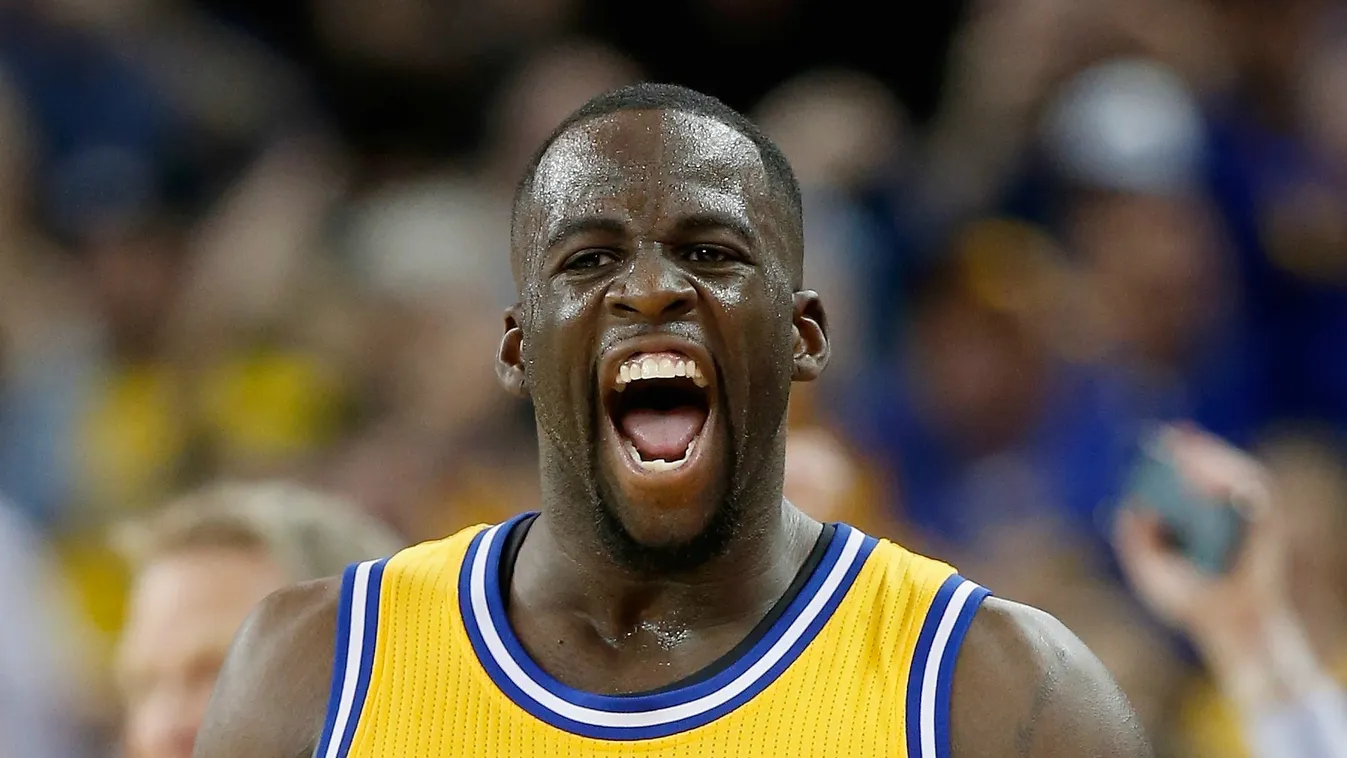 Draymond Green #23 of the Golden State Warriors reacts after making a three-point basket in overtime against the Atlanta Hawks 