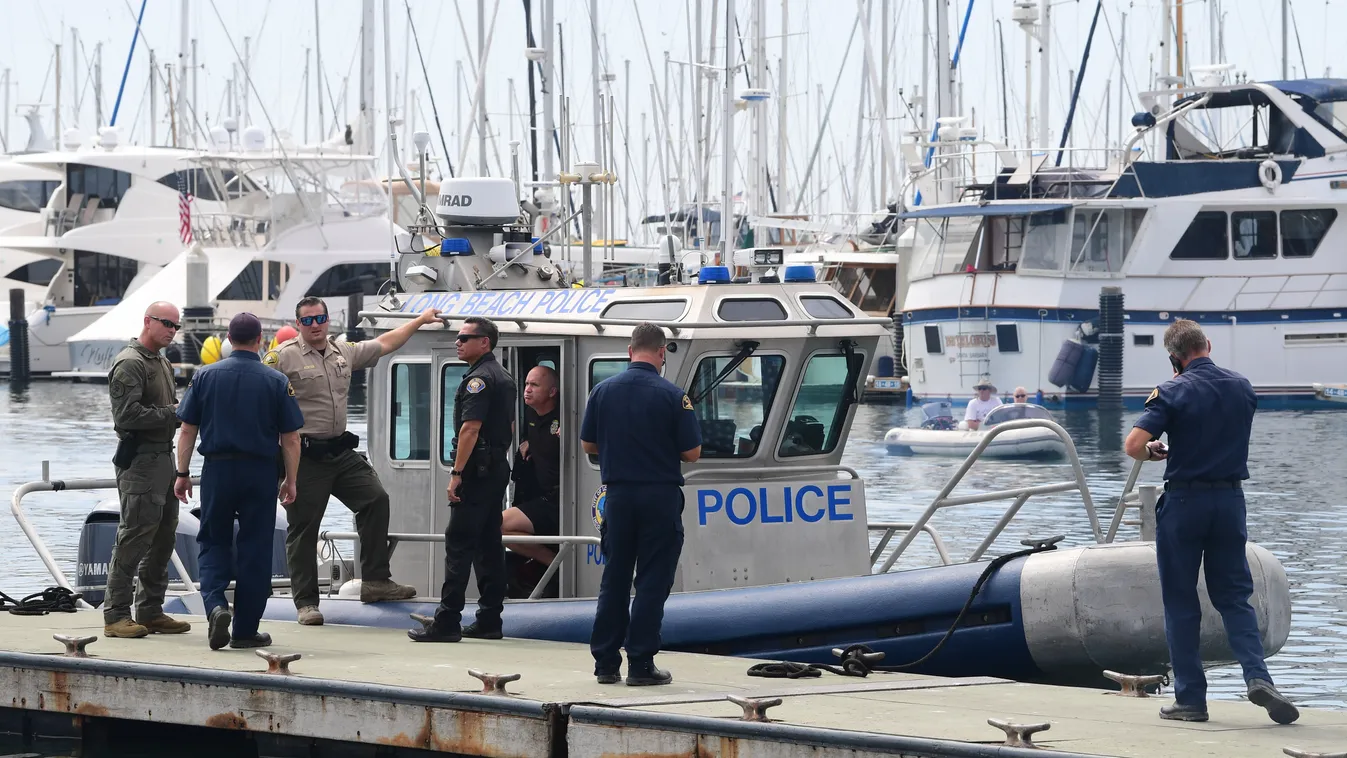 Horizontal Law enforcement officers wait on September 3, 2019, in Santa Barbara, California. - Authorities on Tuesday suspended the search for survivors of a scuba diving boat disaster in Santa Cruz Island off the California coast after recovering 20 bodi
