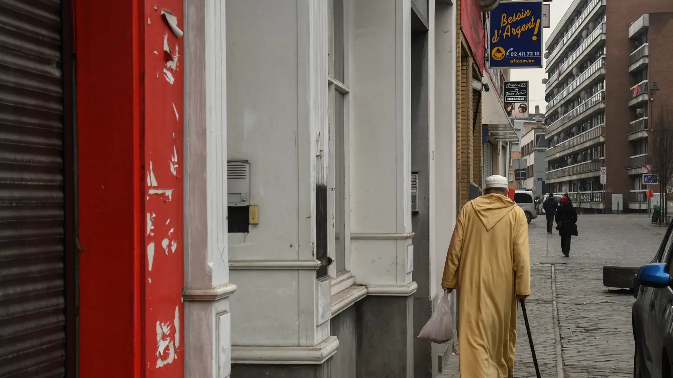 street scene, Molenbeek,Brussels appearance IMMIGRANT clothing hats_and_headgear migrant STREET SCENE CITY RELIGION integration believing IMMIGRATION Religions headwear MAN migration immigrated belief clothes faith Islam MUSLIM caftan robe Religion_and_Be
