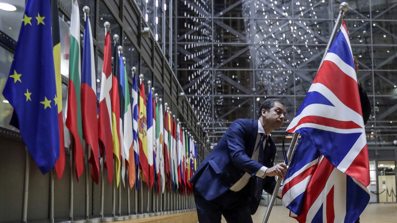 diplomacy politics Horizontal EU Council staff members remove the United Kingdom's flag from the European Council building in Brussels on Brexit Day, January 31, 2020. - Britain leaves the European Union at 2300 GMT on January 31, 2020, 43 months after th