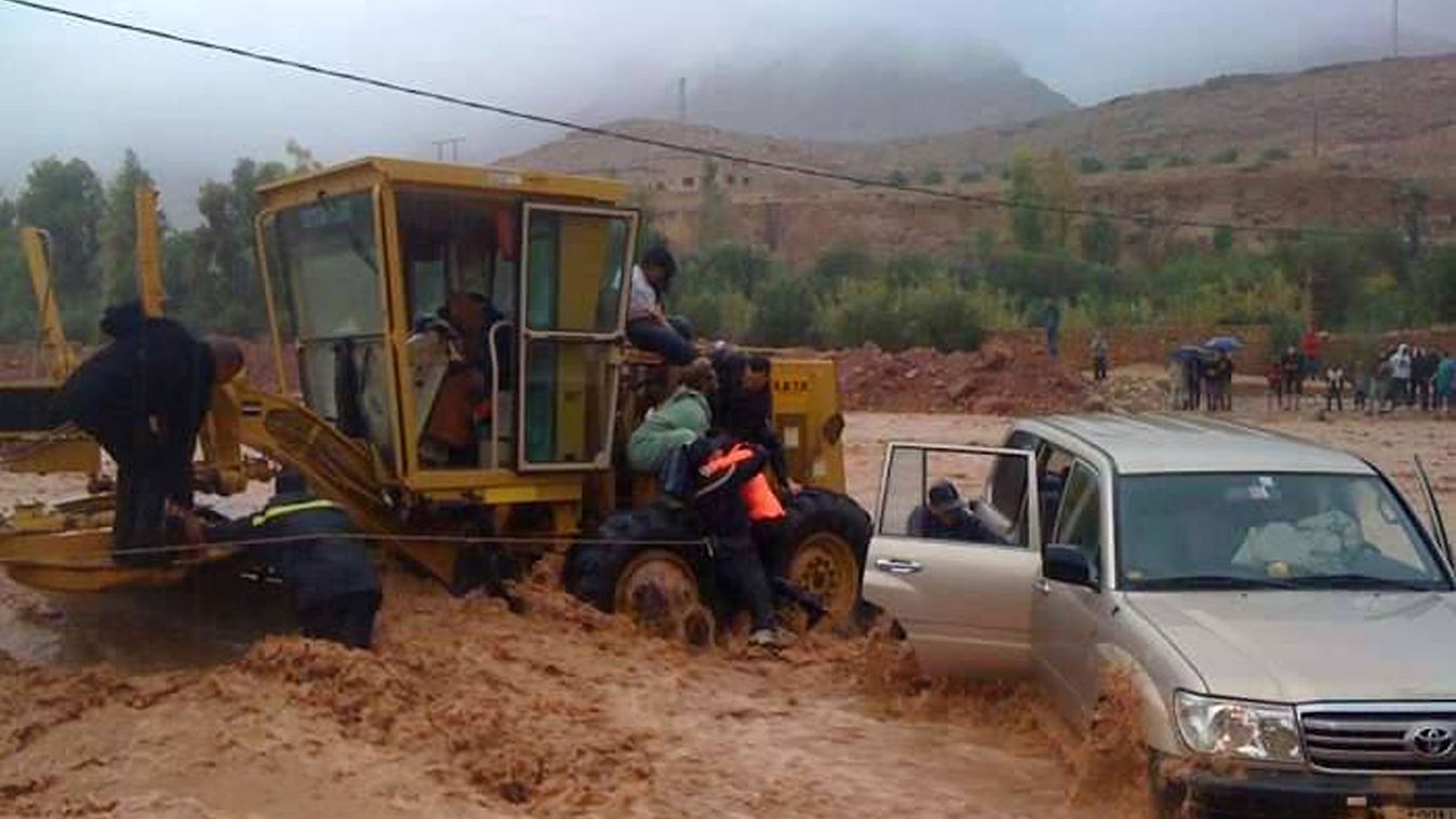 Firemen rescue a driver trapped in flood waters  November 22, 2014 in the southern region of  Ouarzazate in Morocco.  At least eight people were killed and 24 were missing as heavy storms lashed southern Morocco, causing flash floods, the authorities said