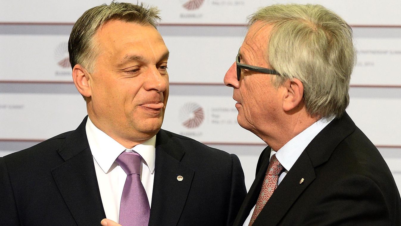Hungarian Prime Minister Viktor Orban is greeted by President of the European Commission Jean-Claude Juncker on the second day of the fourth European Union (EU) eastern Partnership Summit in Riga, on May 22, 2015 as Latvia holds the rotating presidency of