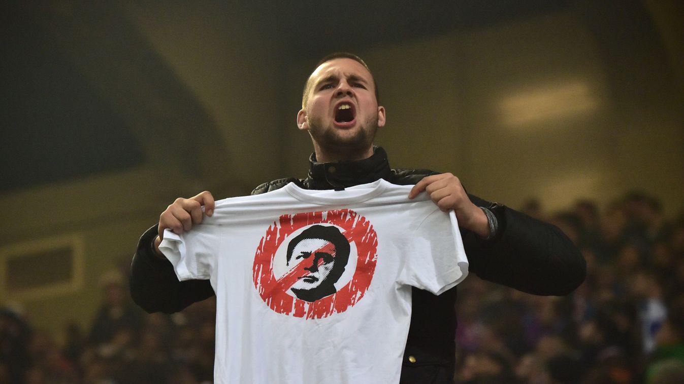 510260551 A supporter shows a tee-shirt with a portrait of the head of Dinamo Belgrad football club Zdravko Mamic during the Euro 2016 qualifying football match Italy vs Croatia on November 16, 2014 at the San Siro stadium in Milan.   AFP PHOTO / GIUSEPPE