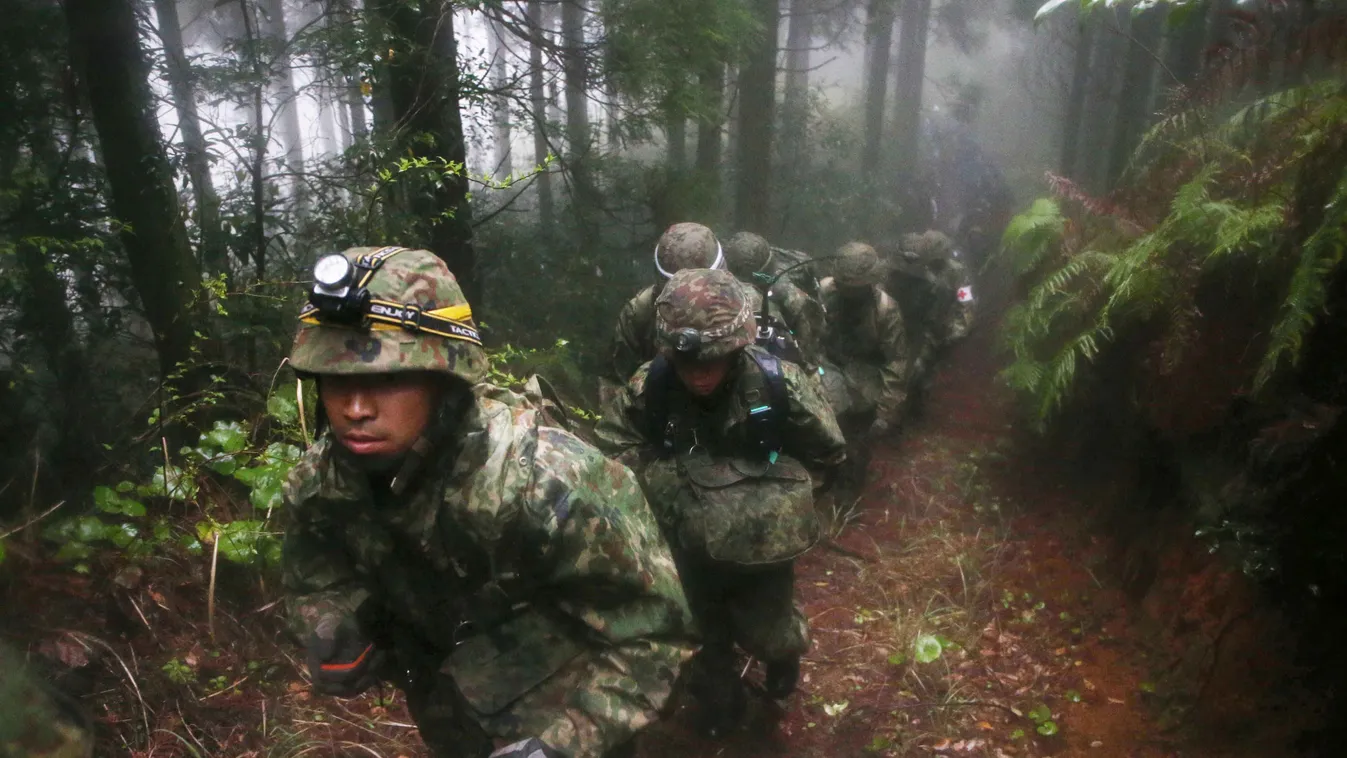 SQUARE FORMAT Members of Japan's Self-Defense Force climb a mountain to search for a Air Self-Defense Force jet, the U-125, carrying six people in Kagoshima Prefecture on April 7, 2016. The plane disappeared off the radar over the city of Kagoshima at aro