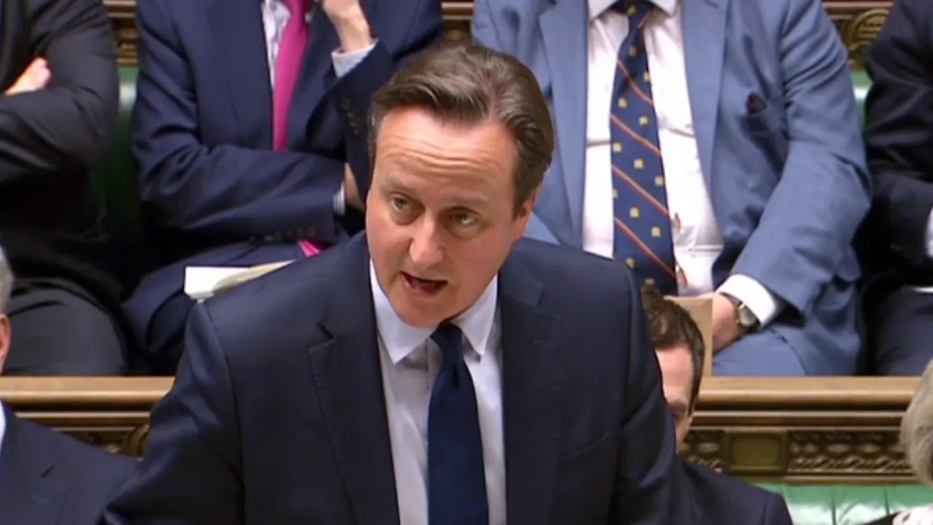 A handout picture released by the UK Parliament’s Parliamentary Recording Unit (PRU) via Parliament TV on November 23, 2015 shows British Prime Minister and Conservative party leader David Cameron making a statement in the House of Commons on increasing f