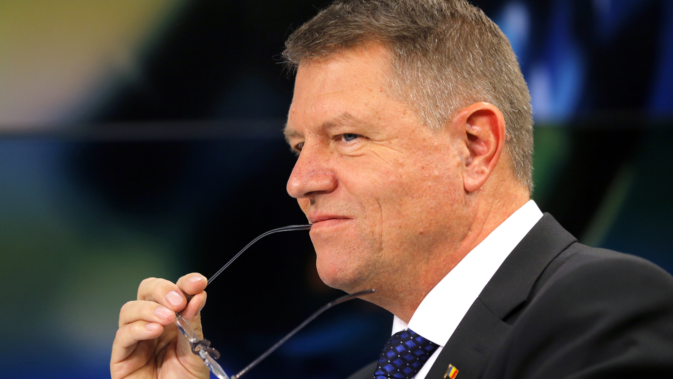 Romanian presidential candidate Klaus Iohannis gestures while discussing with his opponent, Romanian Prime Minister during a TV debate in Bucharest on November 12 , 2014. Prime Minister Victor Ponta  won the first round of the presidential with 40.44 perc