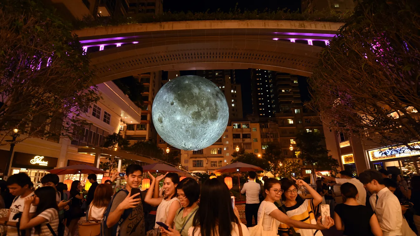 Get lit under giant moon in Hong Kong to celebrate Mid-Autumn Festival China Chinese Hong Kong Museum of the Moon moon sculpture installation Mid-Autumn Festival Lee Tung Avenue British artist Luke Jerram 
