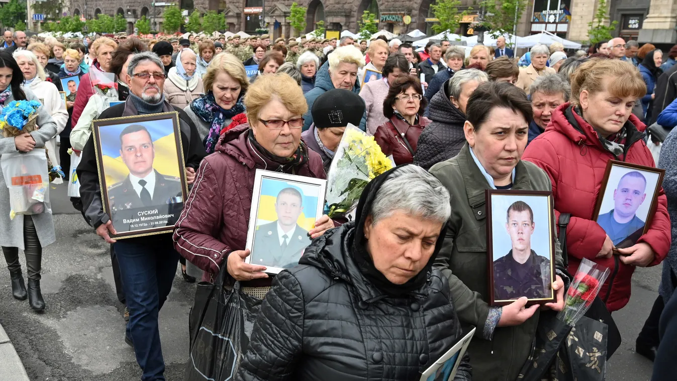 conflict Horizontal Mothers carry portraits of their sons, Ukrainian servicemen, who died in the war against Russia-backed separatists in the east of the country, during their march marking Remembrance and Reconciliation Day in Kiev on May 8, 2019. (Photo