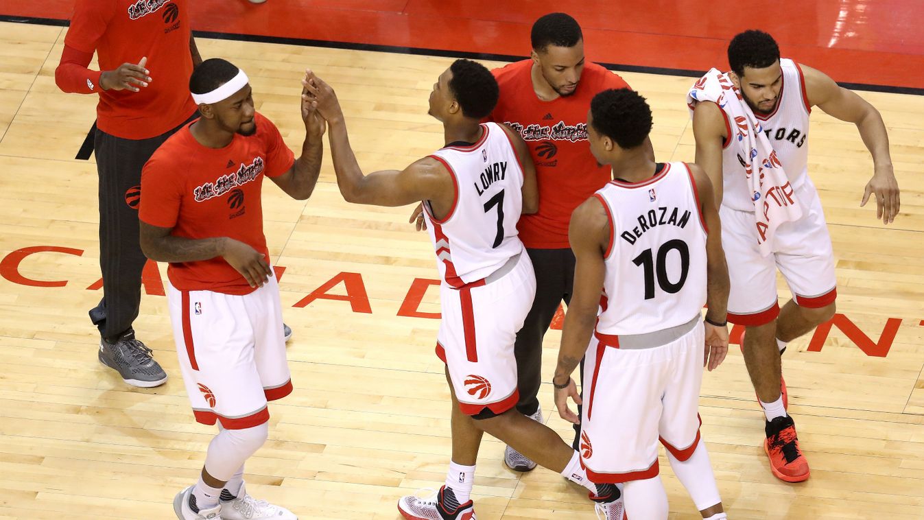 Kyle Lowry #7 and DeMar DeRozan #10 of the Toronto Raptors celebrate with teammates late in the game against the Cleveland Cavaliers in game four of the Eastern Conference Finals during the 2016 NBA Playoffs at the Air Canada Centre in Toronto 