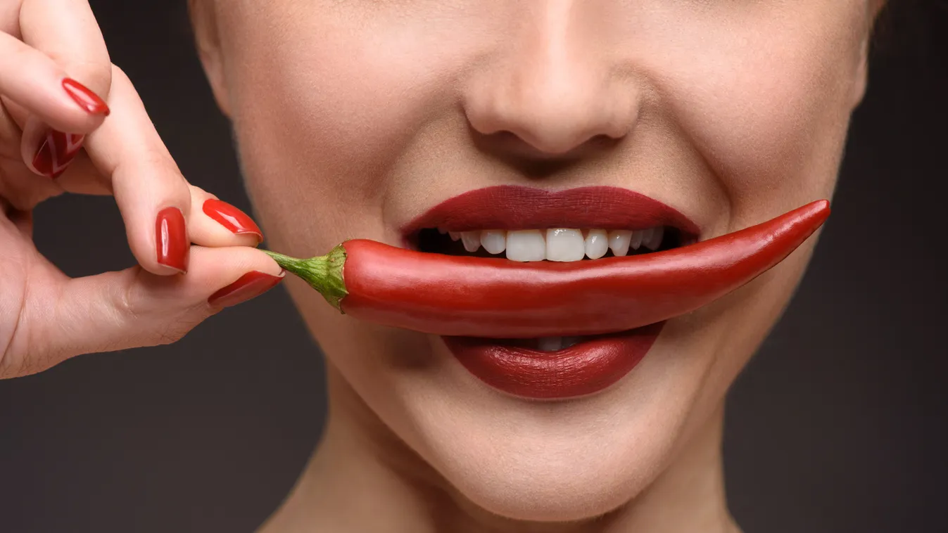 adult attractive beautiful biting bright caucasian chili close-up cute desire eat elegant energy expressing expression face female flirting food girl healthy hot isolated lady lifestyle lips looking lovely mouth naked natural passion pepper perfection pre