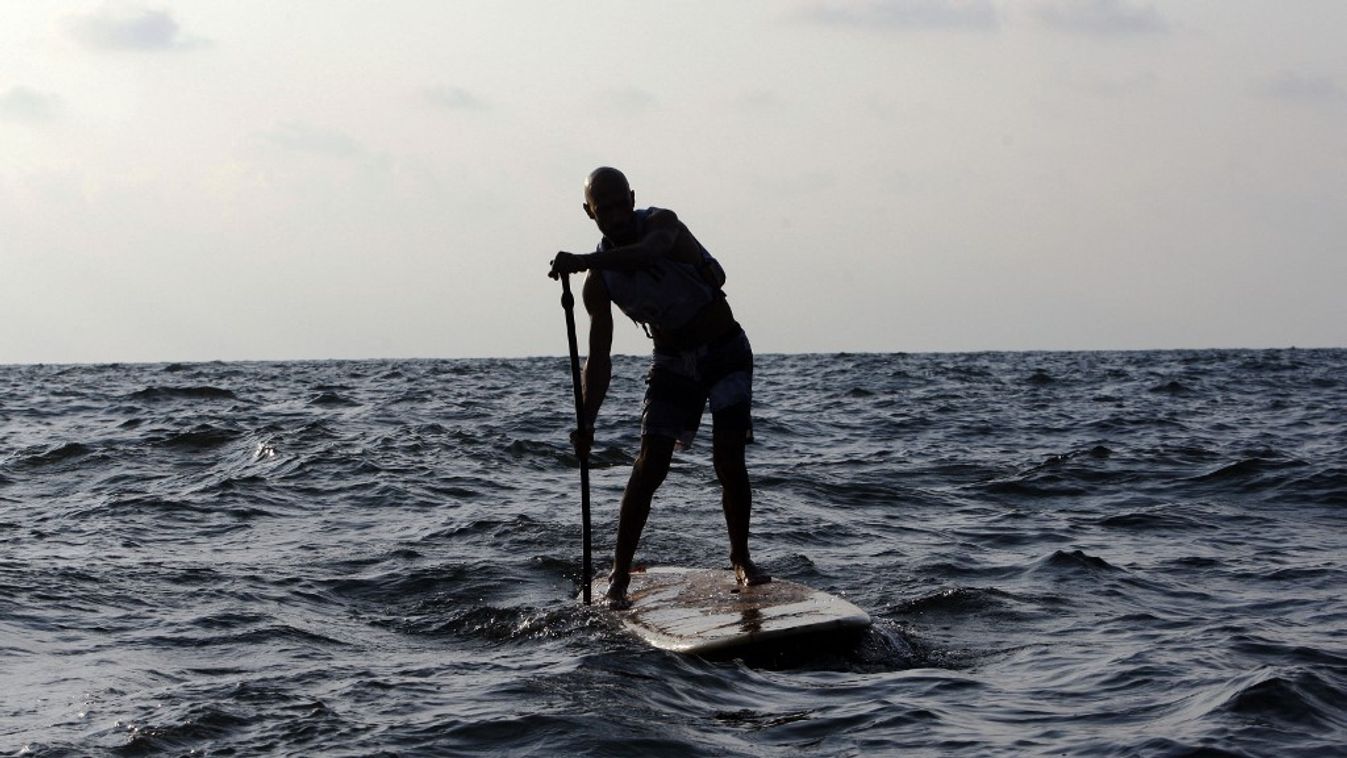 Beirut Lebanon Standup paddle SUP Human interest Water Sport Surfers Paddler People Natural arching structures landmark competition StandUp Paddling Horizontal SPORT SURFING SEA MAN WOMAN TOURIST RACE SQUARE FORMAT 