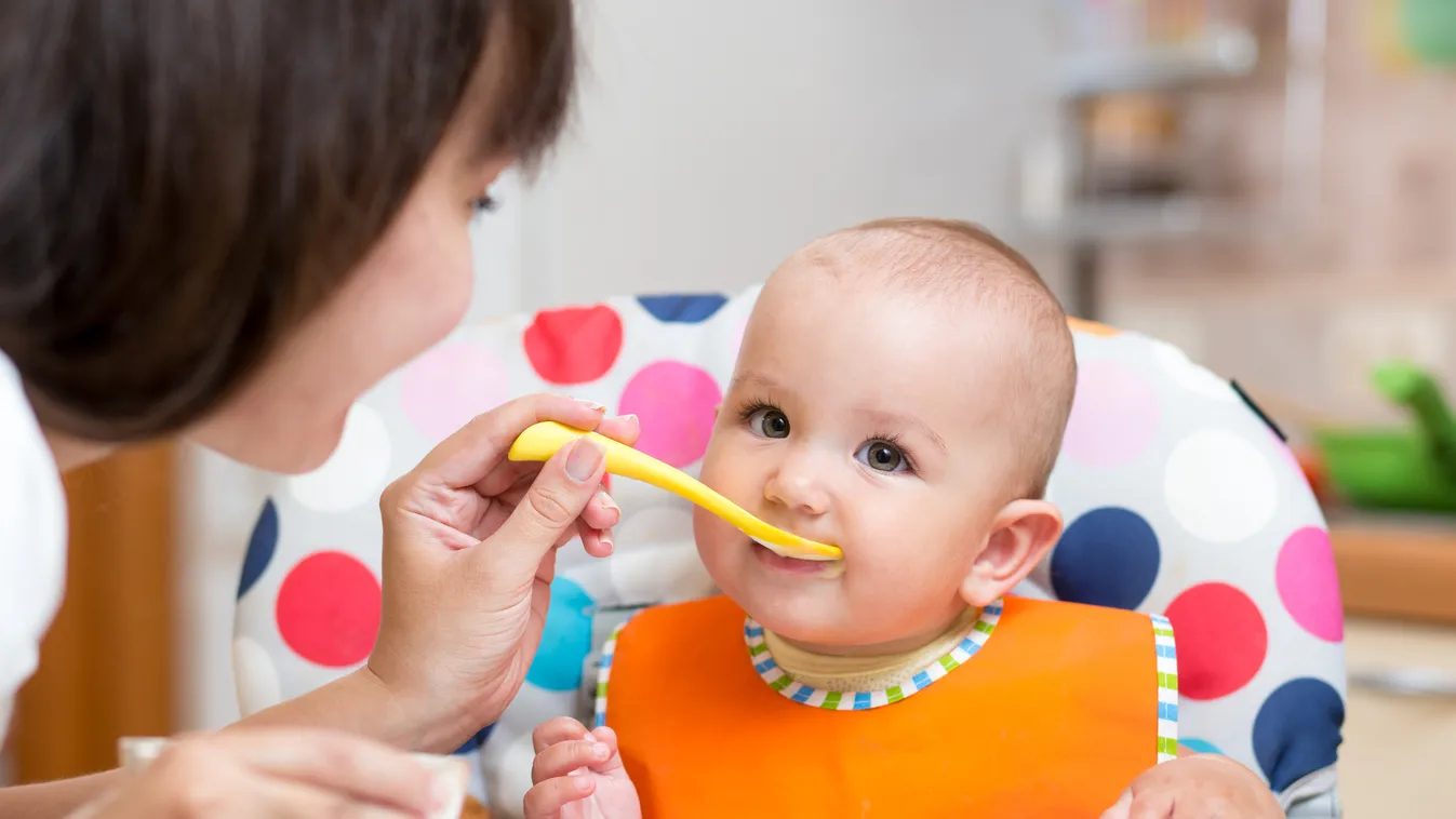 smiling baby eating food with mom on kitchen Dining Dieting Meal Hungry Cute Pureed Child Baby Eating Holding Innocence Small Childhood Indoors Mother Parent Family People Vegetable Breakfast Lunch Dinner Food Crockery Spoon Table smiling baby girl eating