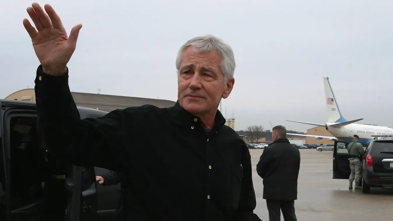 GettyImageRank3 BOARD Journey Air Vehicle HORIZONTAL Leaving WAVING USA Maryland POLITICS Travel Chuck Hagel Joint base andrews Joint Base Andrews, Maryland JOINT BASE ANDREWS, MD - DECEMBER 05: U.S. Secretary of Defense Chuck Hagel waves before he boards