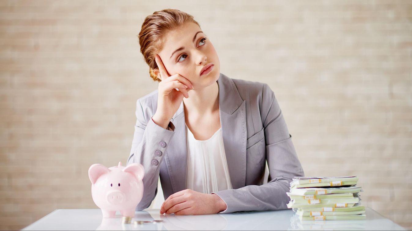 Calculating savings Businesswoman Young Women Women Banking Savings Investment Coin Bank Counting Piggy Bank Paper Currency Currency Day Dreaming Sitting Thinking Calculating One Person Wealth Aspirations Stack Business Finance Pensive Manager Business Pe