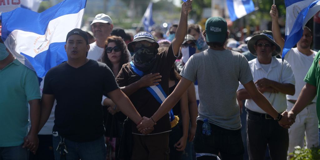 unrest Horizontal People wait for the arrival of the students of the National Autonomous University of Nicaragua (UNAN) -who hid overnight in a church during an attack of government forces- at the Cathedral in Managua, on July 14, 2018.
Government forces 