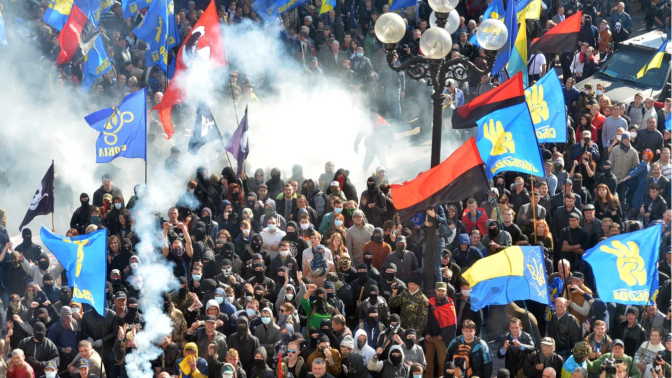 Far-right parties and movements activists clash with riot police in front of the Ukrainian Parliament in Kiev on October 14, 2014. Ukraine's parliament on October 14 confirmed National Guard chief Stepan Poltorak as the former Soviet state's fourth defenc