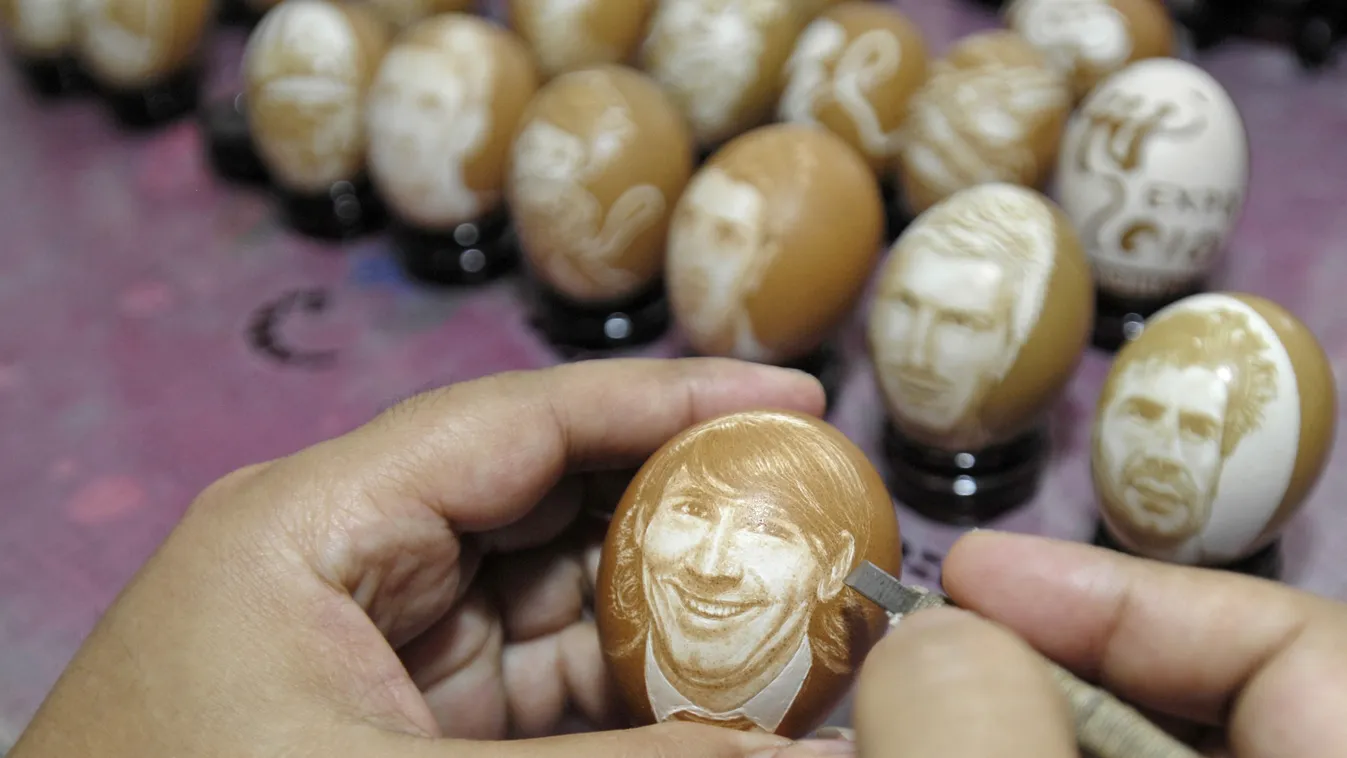 Chinese artist carves soccer players on eggs to celebrate World Cup China Chinese artist sculptor carver egg eggshell portrait soccer football player World Cup 2010 Horizontal 