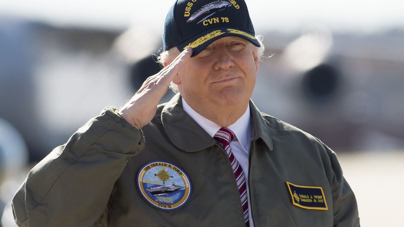 TOPSHOTS Horizontal US President Donald Trump salutes as he walks to Air Force One prior to departing from Langley Air Force Base in Virginia, March 2, 2017, as he traveled to Newport News, Virginia, to visit the pre-commissioned USS Gerald R. Ford aircra