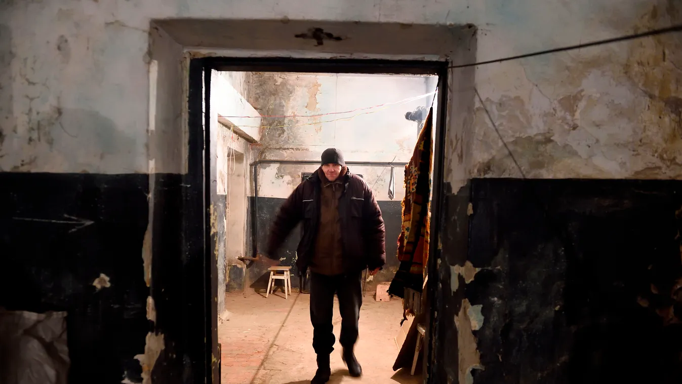 A man walks in the cellar of his building used as a shelter in Kievskiy district witch is often sheld in the eastern Ukrain city of Donetsk , controlled by pro-russian rebels, on December 10, 2014. A cease-fire started a day before seams to be globaly res