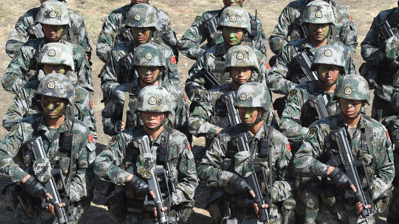 Horizontal People's Liberation Army (PLA) of China soldiers line up after participating in an anti-terror drill during the Sixth India-China Joint Training exercise "Hand in Hand 2016" at HQ 330 Infantry Brigade, in Aundh in Pune district, some 145km sout