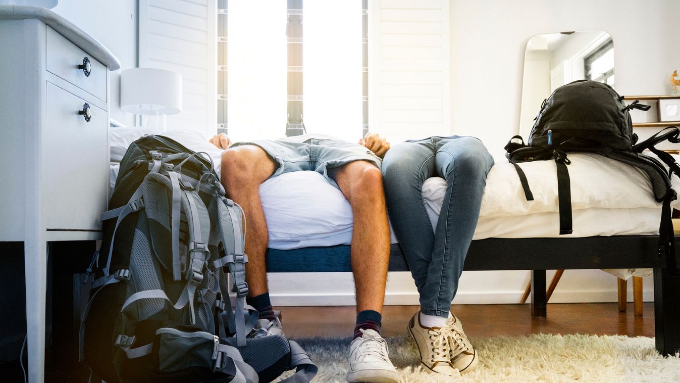 Low section of tired couple resting on bed Couple - Relationship Brightly Lit Travel Fashion People Traveling Tourism Leisure Activity Young Women Females Young Men Males Two People Adults Only Hotel Room Young Adult Backpack Leaning Resting Caucasian Eth