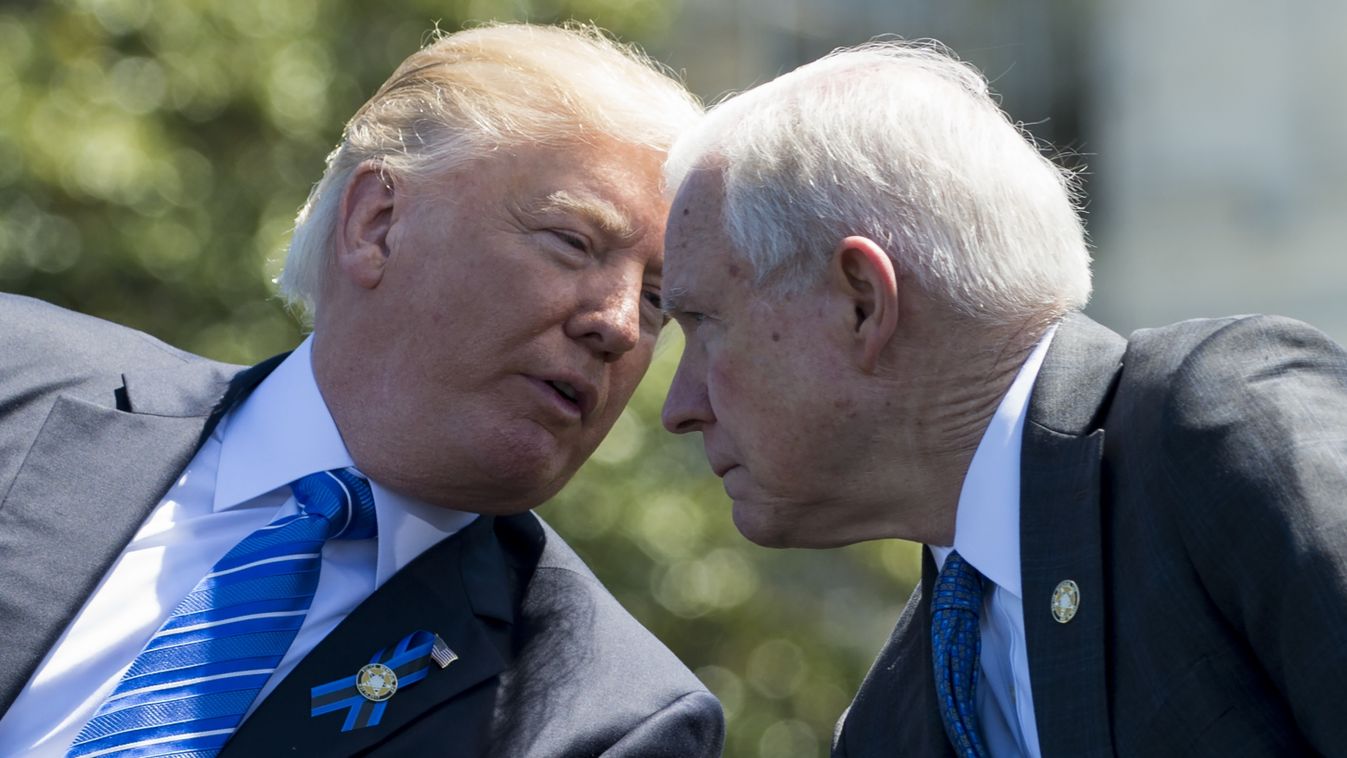 Horizontal US President Donald Trump speaks with Attorney General Jeff Sessions (R) during the 36th Annual National Peace Officers’ Memorial Service at the US Capitol in Washington, DC, May 15, 2017. / AFP PHOTO / SAUL LOEB 