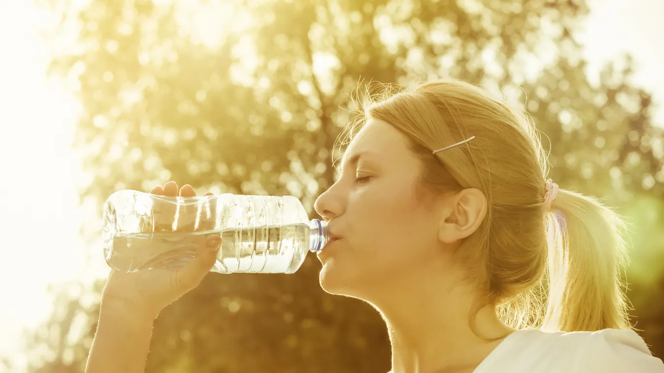 Drinking water after exercise "Beautiful 20s Action Beauty And Health Blond Hair Bottle Caucasian Drink Drinking Enjoyment Exercise Exercising Eyes Closed Female Fitness" Gold Healthy Lifestyle Heat Holding Horizontal Human Face Human Head Lens Flare Morn