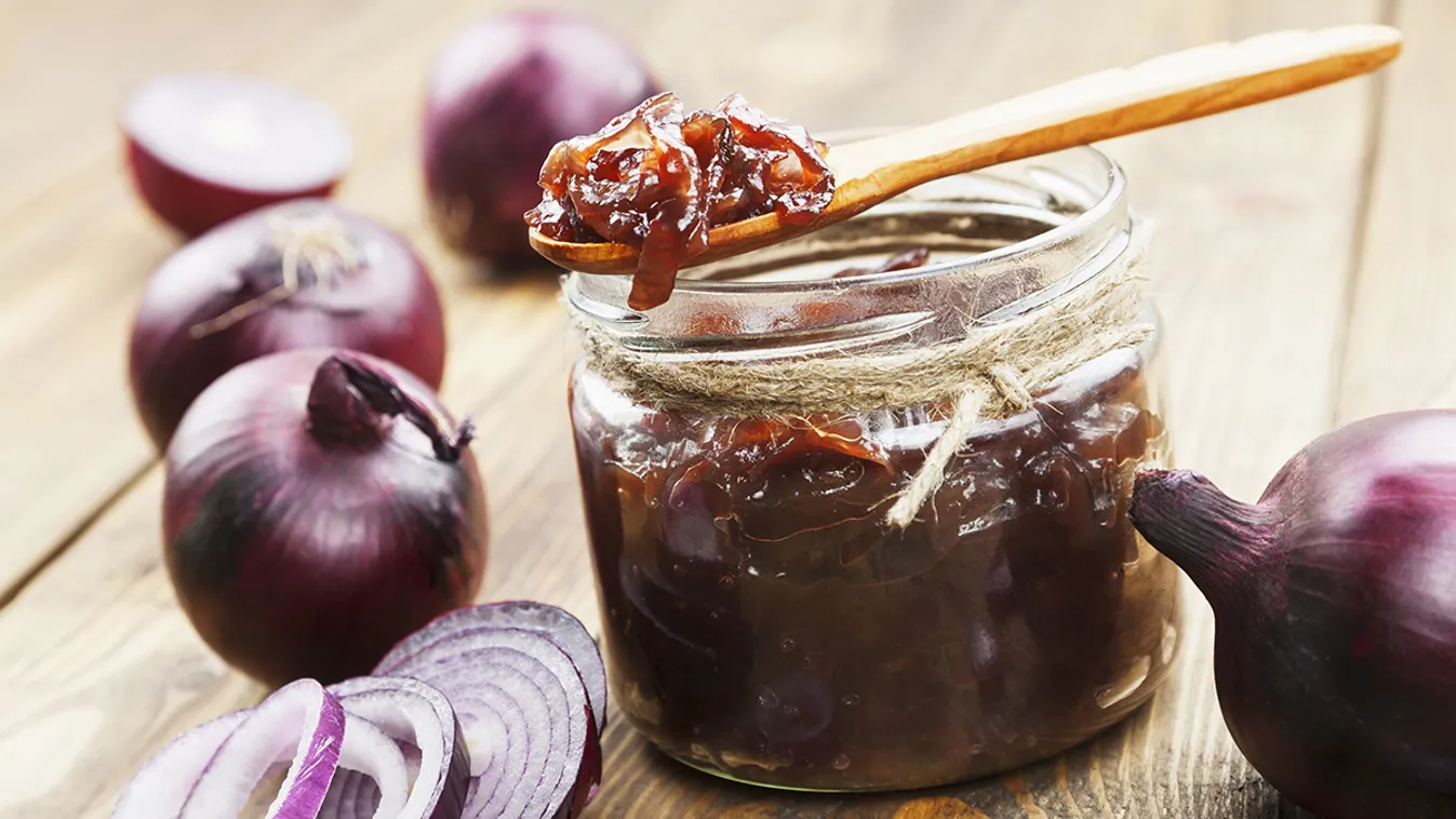 Onion,Jam,In,A,Glass,Jar,On,A,Wooden,Table Onion jam in a glass jar on a wooden table 