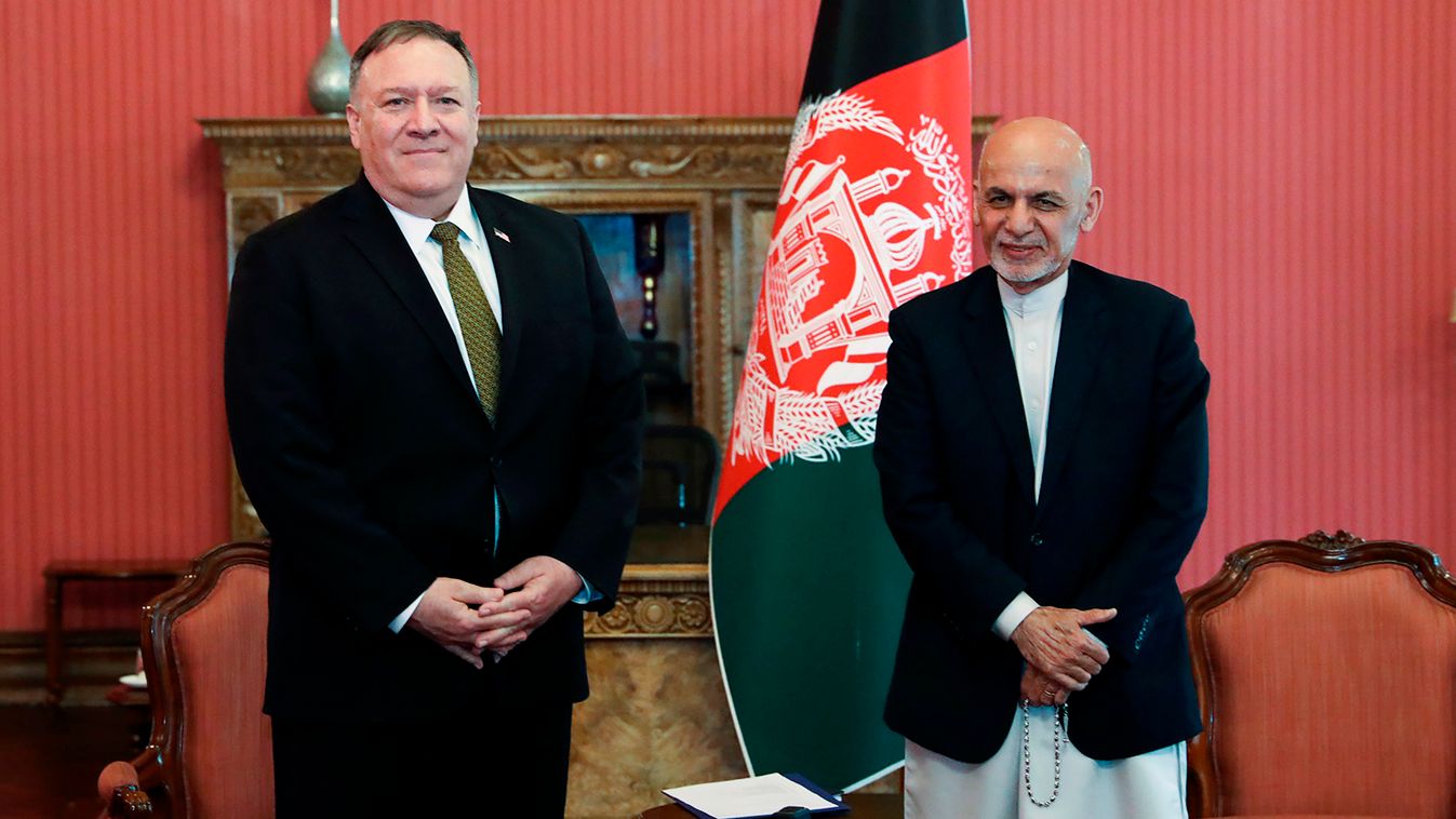 diplomacy Horizontal In this handout photograph taken and released by Press Office of President of Afghanistan on March 23, 2020, Afghanistan's President Ashraf Ghani poses for a picture with US Secretary of State Mike Pompeo (L) during their meeting in K
