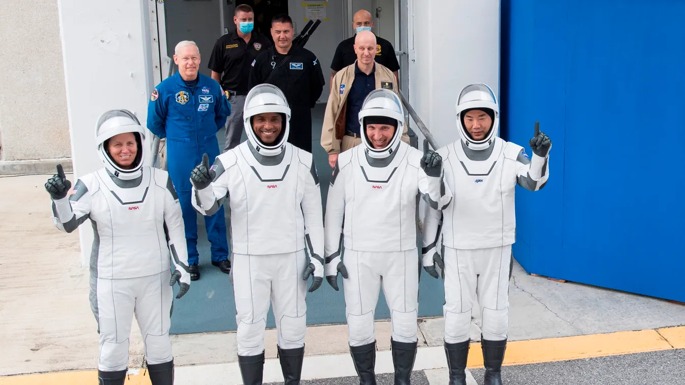Horizontal SPACE MISSION This NASA photo shows NASA astronauts Shannon Walker(L), Victor Glover(2ndL),Mike Hopkins(2ndR) and Japan Aerospace Exploration Agency (JAXA) astronaut Soichi Noguchi(R), wearing SpaceX spacesuits, as they walk out of the Neil  A.