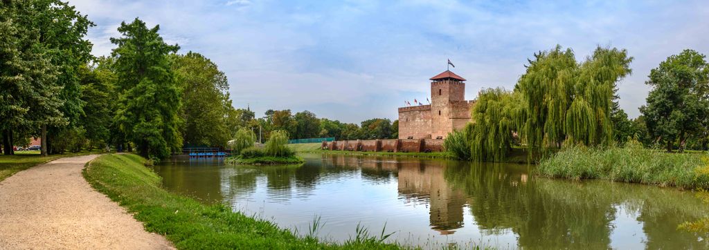 Gyula 2021 
 The,Only,Remaining,Brick-built,Medieval,Fortress.,In,Front,Of,The assault,pond,mirror,castle,color,city,hungarian,building,summer, The only remaining brick-built medieval fortress. In front of the castle is a boating lake and a 