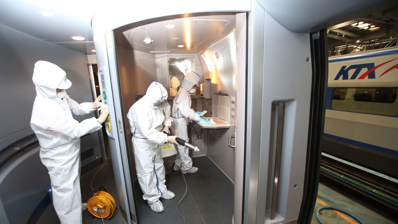 Workers disinfect a train carriage at a station in Seoul on June 7, 2015. South Korea on June 6 confirmed nine more cases of the MERS virus, which has killed four people, but said it did not represent a spread of the outbreak as the infected were already 