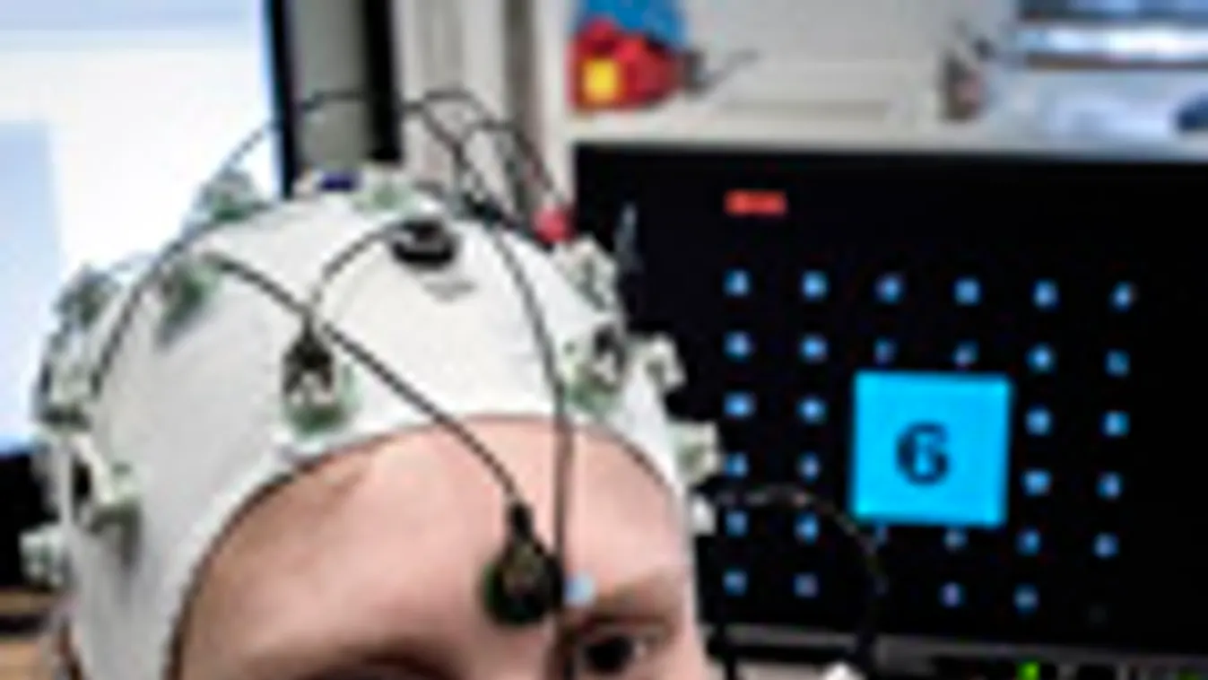 agykutatás a lyoni neurológiai kutatóközpontban, ahol elektródákat erősítenek egy vizsgálati alany fejére