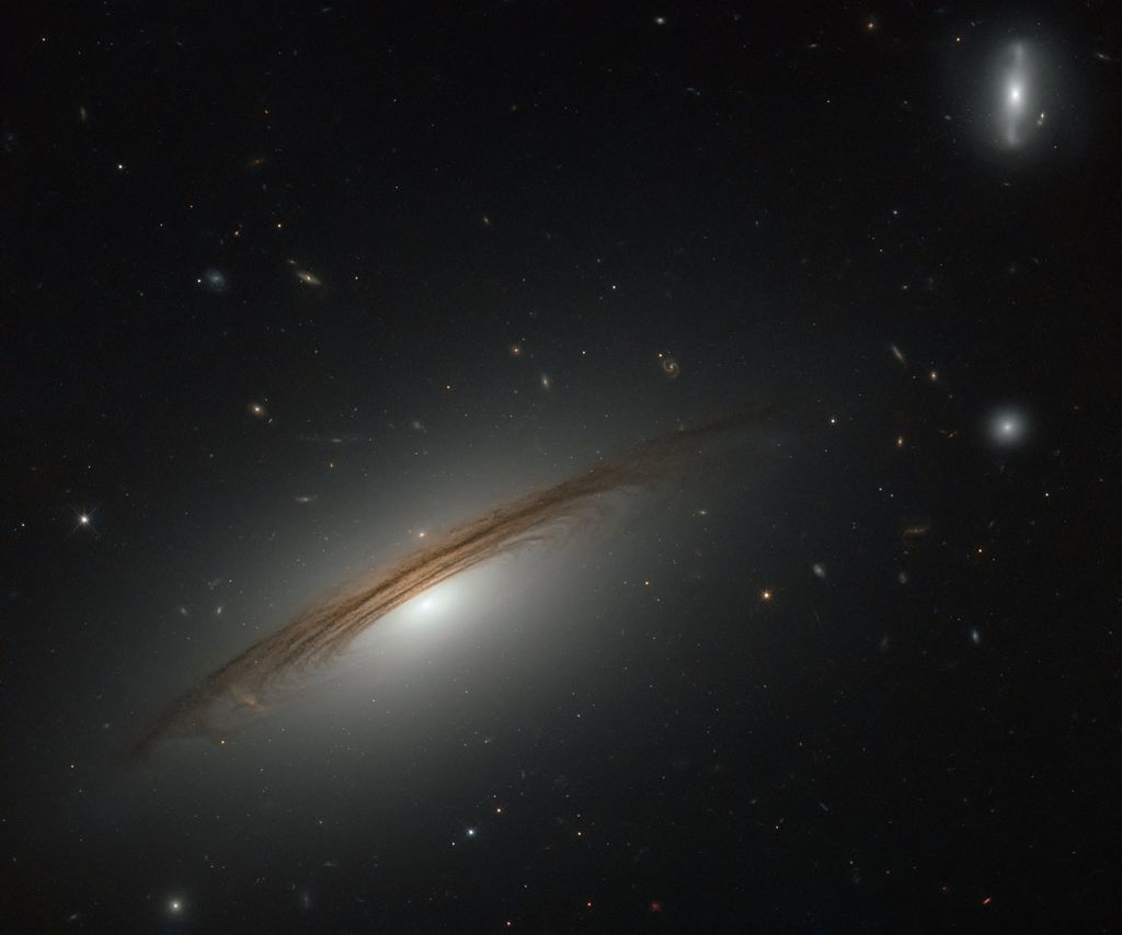 LEDA 71392 UGC 12591 This NASA/ESA Hubble Space Telescope image showcases the remarkable galaxy UGC 12591. Classified as an S0/Sa galaxy, UGC 12591 sits somewhere between a lenticular and a spiral. It lies just under 400 million light-years away from us i