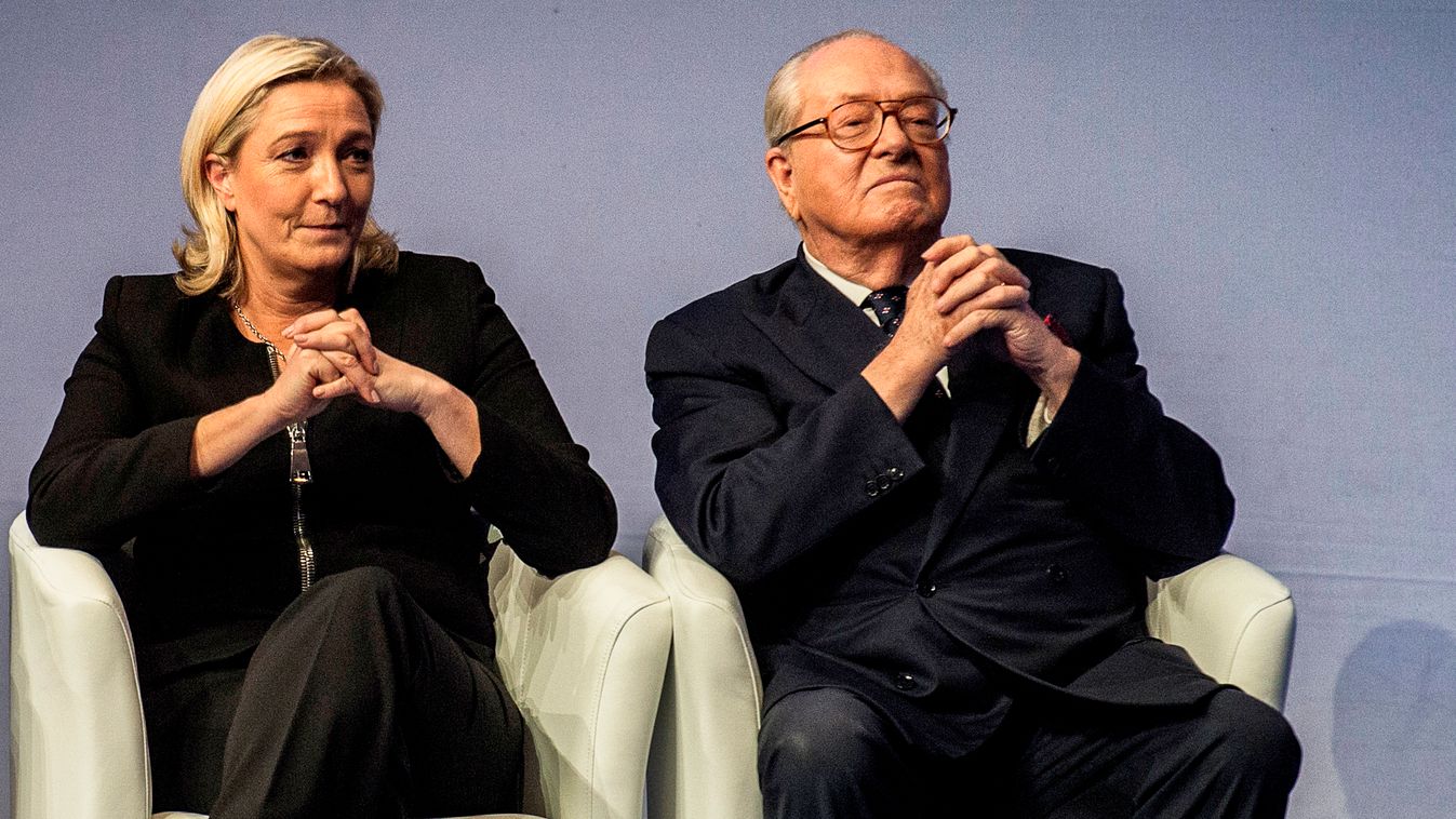 (FILES) - A picture taken on November 29, 2014 in Lyon shows France's former far-right Front National (FN) party's leader Jean-Marie Le Pen (R) and France's far-right Front National (FN) party’s leader Marine Le Pen (L),  during the 15th French far-right 