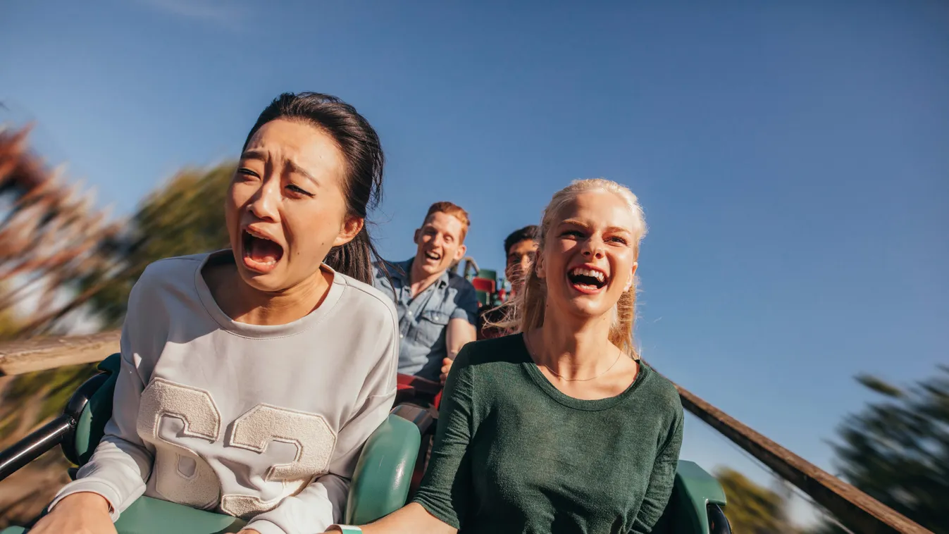 shutterstock Shot,Of,Young,Friends,Cheering,And,Riding,Roller,Coaster,At rollercoaster,young,weekend,riding,girls,speed,summer,beautiful, Shot of young friends cheering and riding roller coaster at amusement park. Young people having fun on rollercoaster.