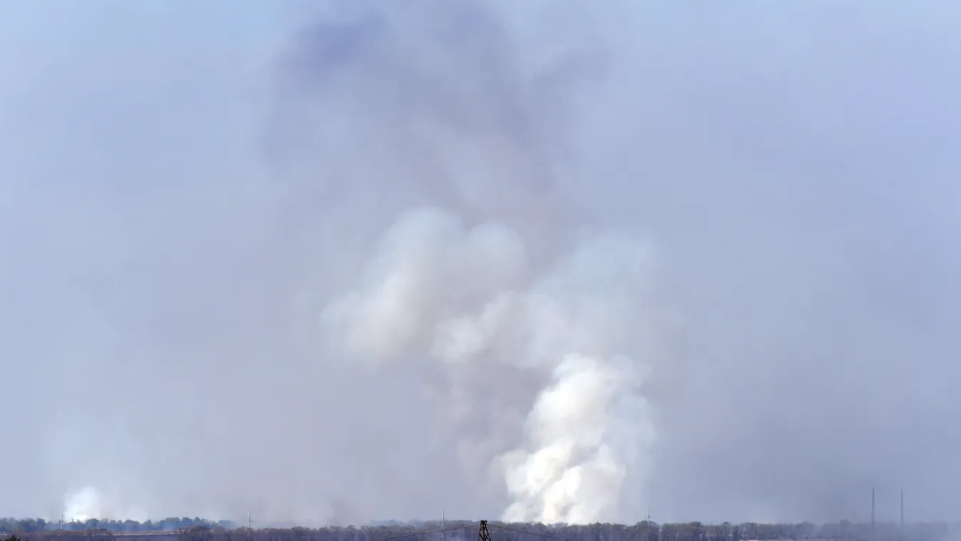 Smoke rises after a weapon factory controlled by pro-russian militants exploded near Donetsk on September 20, 2014, few hours after Ukraine and pro-Russian separatists agreed a deal to reinforce a two-week-old ceasefire, calling for the creation of a demi
