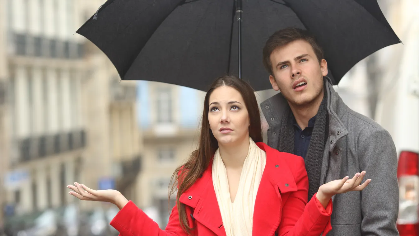 Couple annoyed in a rainy day Couple - Relationship Beautiful Girls Teenage Girls Women Men Overcast Weather Young Adult Adult Looking Disgust Backgrounds Cold - Temperature Frustration Problems Luck Emotional Stress Sadness Disappointment Friendship Conc