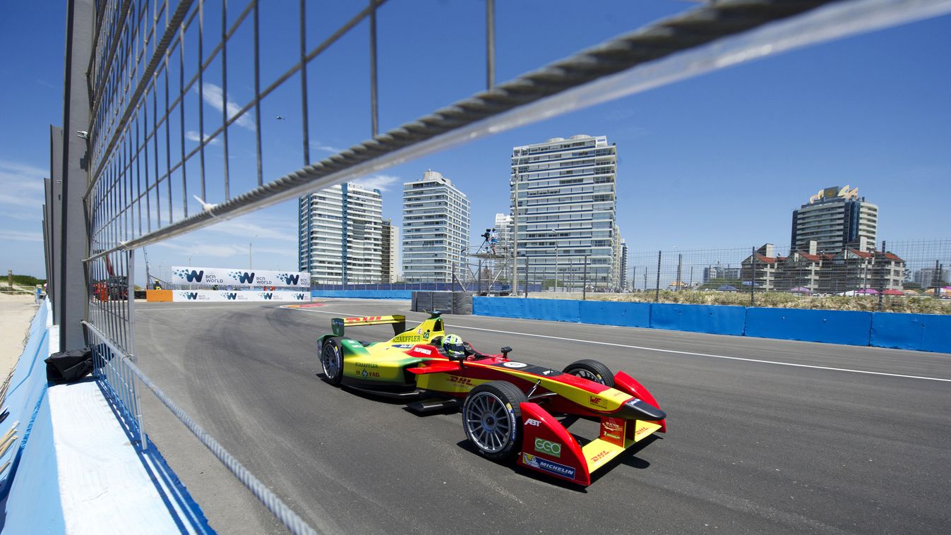 A Formula E Audi Sport ABT driver Lucas Di Grassi powers his car during the qualifying session in Punta del Este, Uruguay on December 13, 2014. Uruguay will host the third race of the inaugural Formula-E electric car race championship. AFP PHOTO / PABLO P