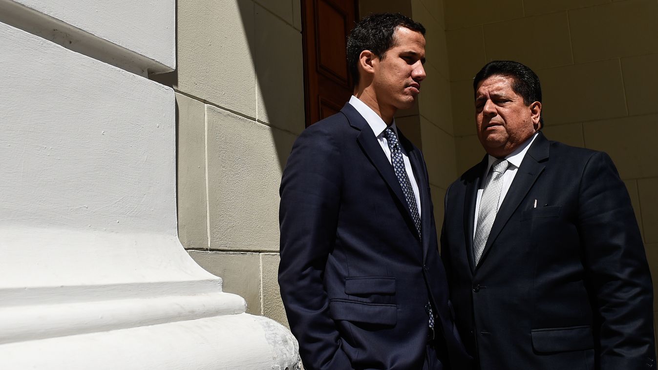 Horizontal The president of Venezuela's opposition-led National Assembly, Juan Guaido (L), talks with first vice president Edgar Zambrano before a session at the Federal Legislative Palace in Caracas on January 22, 2019. - Venezuela's Supreme Court declar