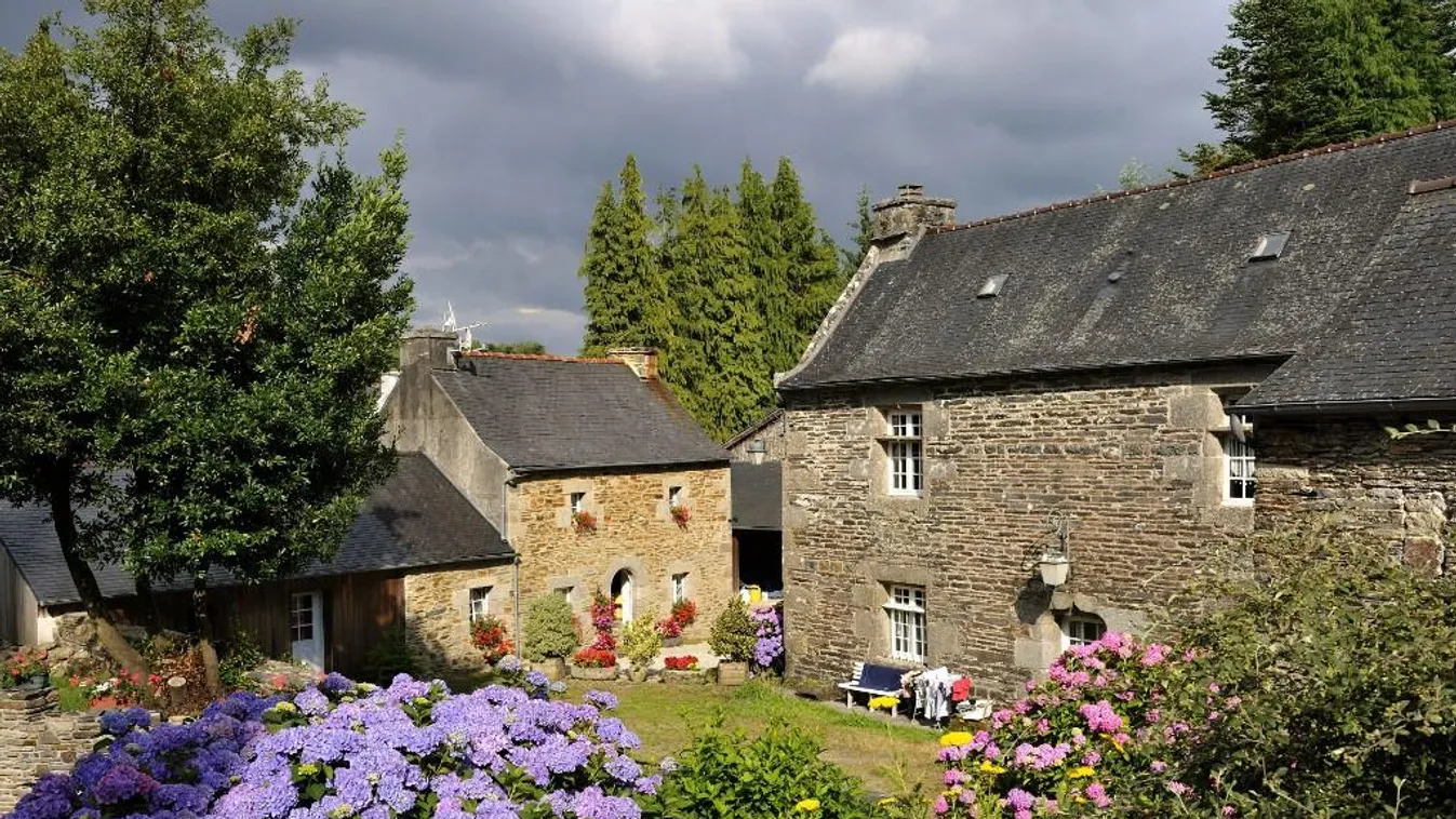 Catholicism Christianity Countryside Day Finistere France French Brittany Gothic Hydrangea medieval times No People Outdoors Saint Herbot West France Horizontal ARCHITECTURE BUILDING CHURCH CLOUD DWELLING EUROPE FACADE FLOWER HISTORY HOUSE RELIGION RELIGI