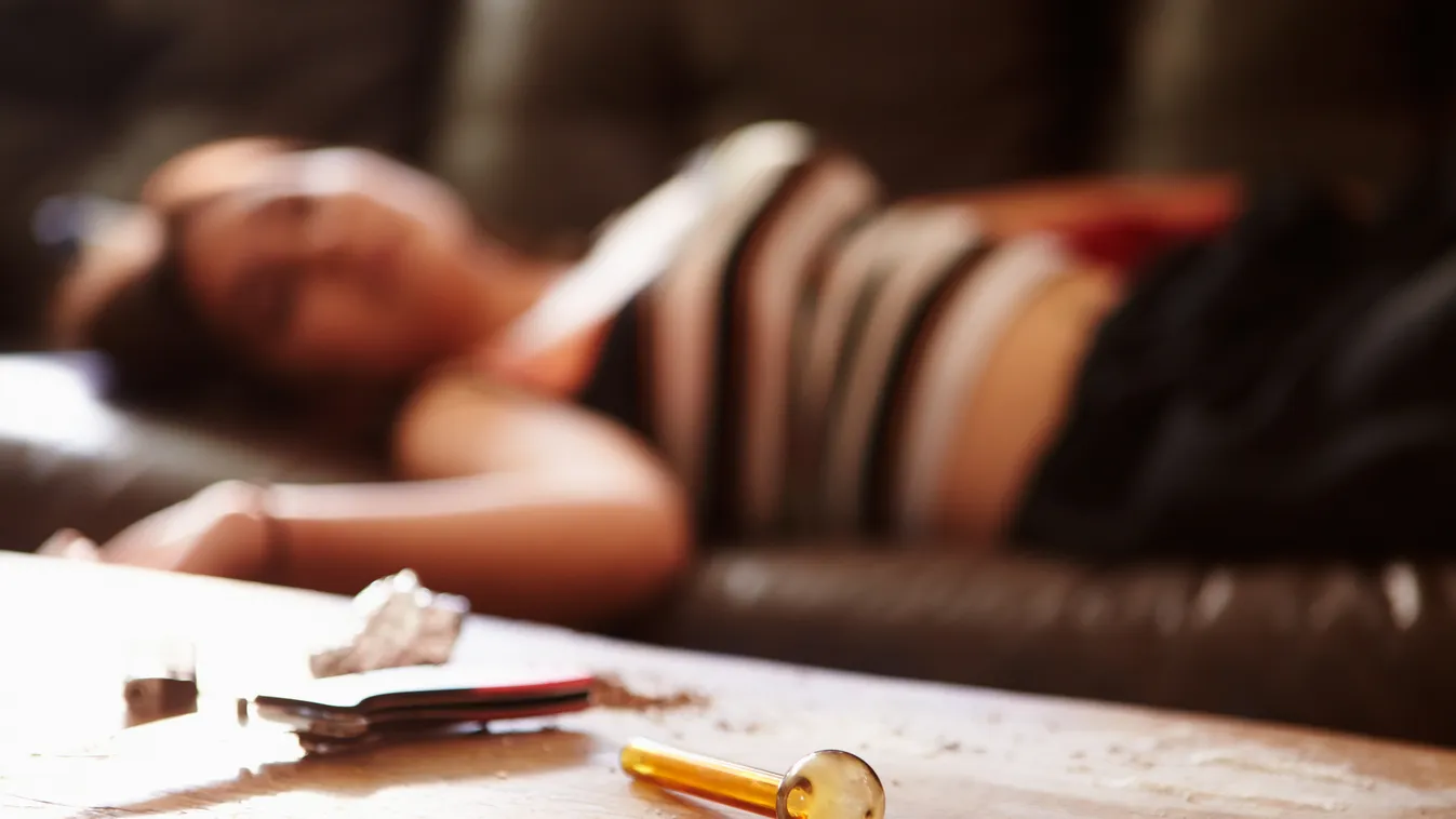 Woman Slumped On Sofa With Drug Paraphernalia In Foreground Addiction Attitude Bong Cocaine Crack Cocaine Crystal Meth Drug Abuse Focus On Foreground Gang Member Gangster Ghetto Giving Horizontal Joint Juvenile Macho Marijuana Narcotic One Person Pipe Pro