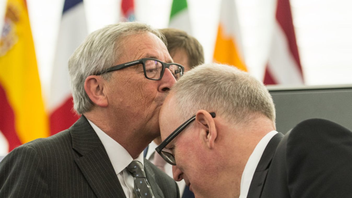 European Parliament in Strasbourg epa04998134 Jean-Claude Juncker , President of the European Commission, kisses the head of First Vice-President of European Commission Frans Timmermans (R) of the Netherlands  before the key debate about the Conclusions o