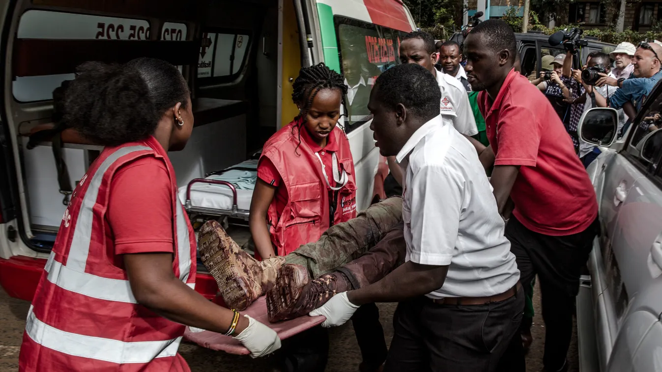 TOPSHOTS Horizontal AFRICA AFTERMATH OF THE TERRORISM TERRORIST ATTACK BOMBING ATTACK TERRORIST ACTION SCENE OF THE ATTACK VICTIM CASUALTY EVACUATION SERVICEMAN SOLDIER PERSON-ACCIDENT AND RESCUE AMBULANCE AMBULANCEMAN PRESS PHOTOGRAPHER JOURNALIST ON THE