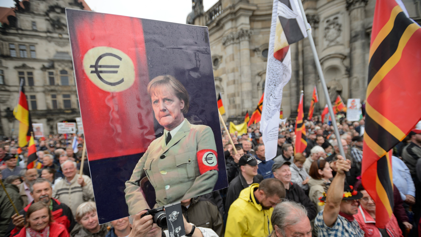 HORIZONTAL EFFIGY CHANCELOR WOMAN PLACARD DEMONSTRATION EXTREME RIGHT PARTY EURO UNIFORM 