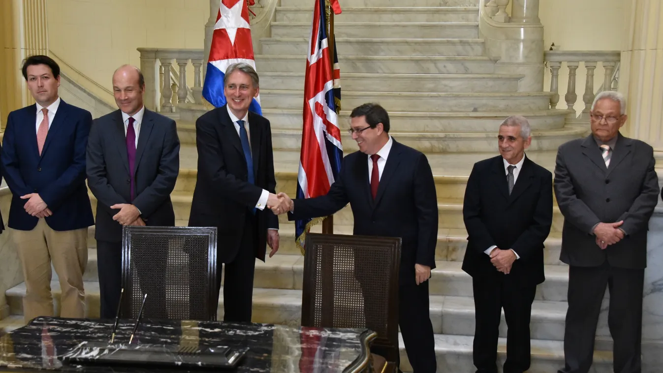 diplomacy Horizontal Britain's Foreign Secretary Philip Hammond (4-L) shakes hands with his Cuban counterpart Bruno Rodriguez (C-R) at the Foreign Affairs Ministry in Havana on April 28, 2016. Hammond arrived in Cuba on Thursday in the first such visit si